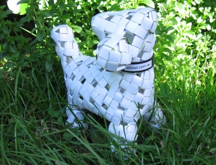 Recycled paper dog behaving himself